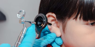 doctor using ostomoscope