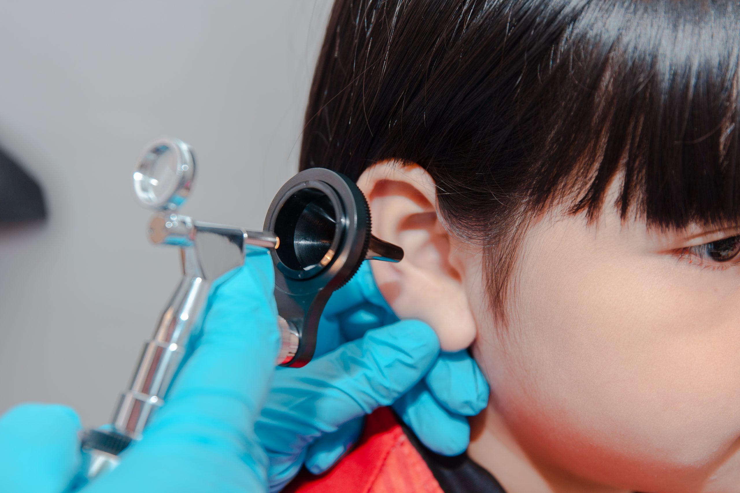 doctor using ostomoscope